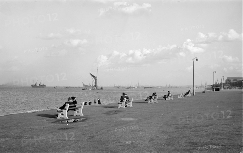 Couples sit on benches on the promenade at Gravesend, Kent, c1945-c1965
