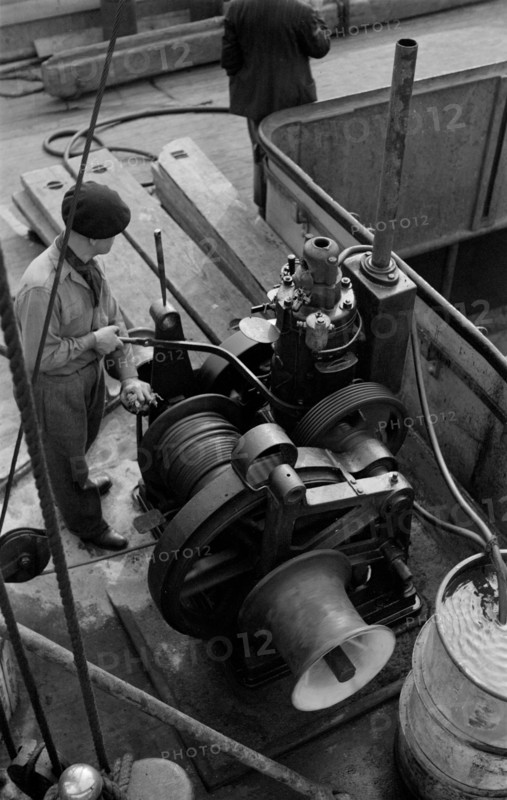 A winchman at work on the River Thames, London, c1945-c1965