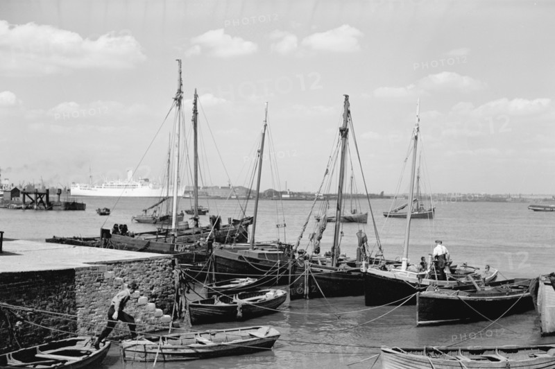 Men working on Bawley boats moored at a quay at Gravesend, c1945-c1965