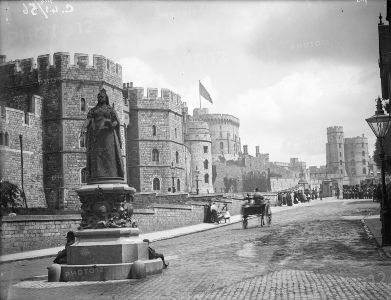Windsor Castle from Pedscoe Street with a statue of Queen Victoria, Windsor, Berkshire, c1860-c1922