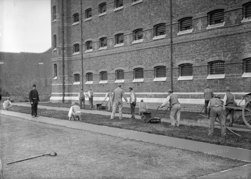 Prisoners cutting grass at Wormwood Scrubs prison, London, c1900-1950