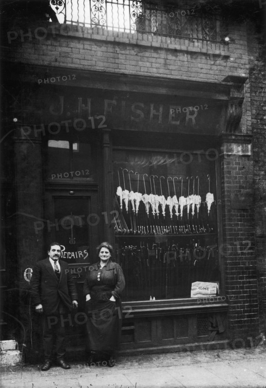 Polish Jews outside their umbrella shop in Hackney, London, c1910. Artist: Unknown