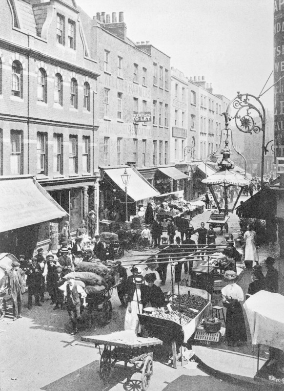 A market in Little Earl Street, looking east, East London. Artist: Unknown