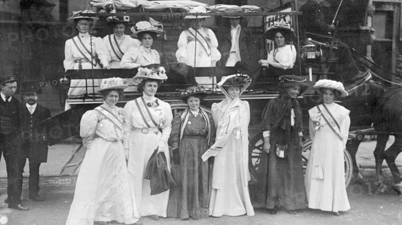 Suffragettes in 'Votes for Women' sashes, c1910. Artist: Unknown