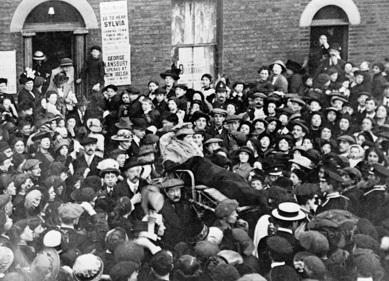 Sylvia Pankhurst leaving the East End of London in a bath-chair, June 1914. Artist: Unknown