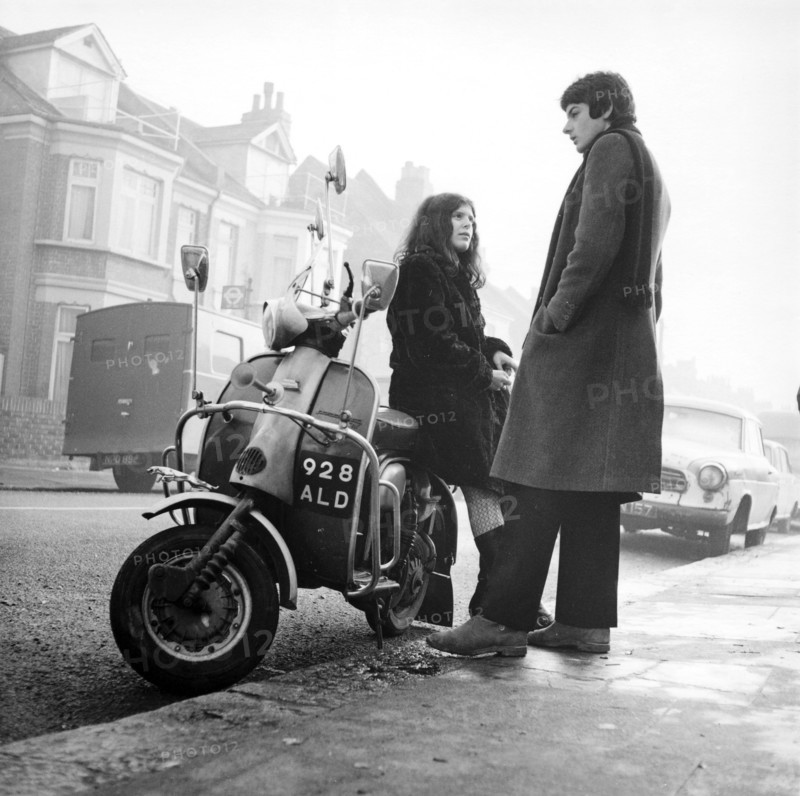 Couple with a scooter, London, 1967. Artist: Henry Grant