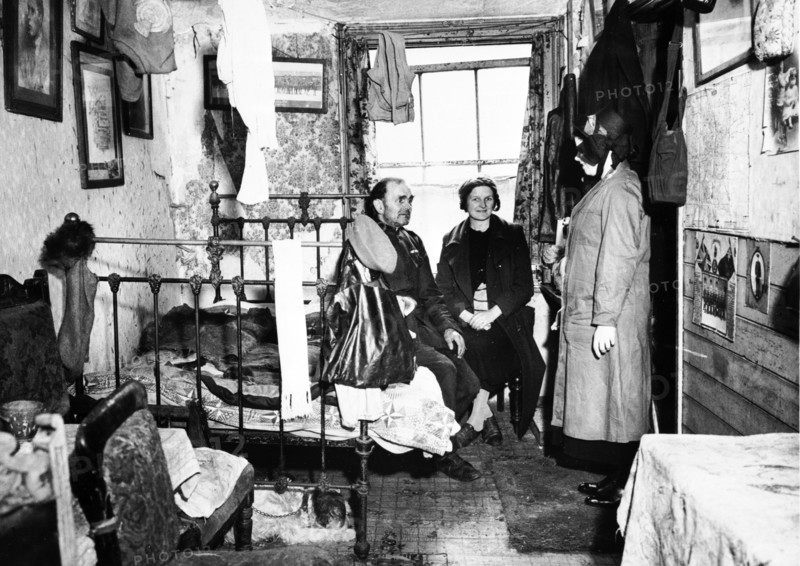 Salvation Army visiting a resident in Notting Hill, London, c1900. Artist: Unknown.