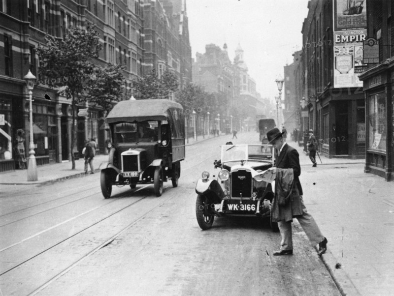 A Rover 1928 10/25 HP sports car parked in a London street, 1931. Artist: Unknown