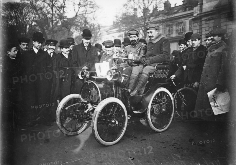 Louis Renault in the driver's seat of a Voiturette Renault 1¾ hp, 1899. Artist: Unknown