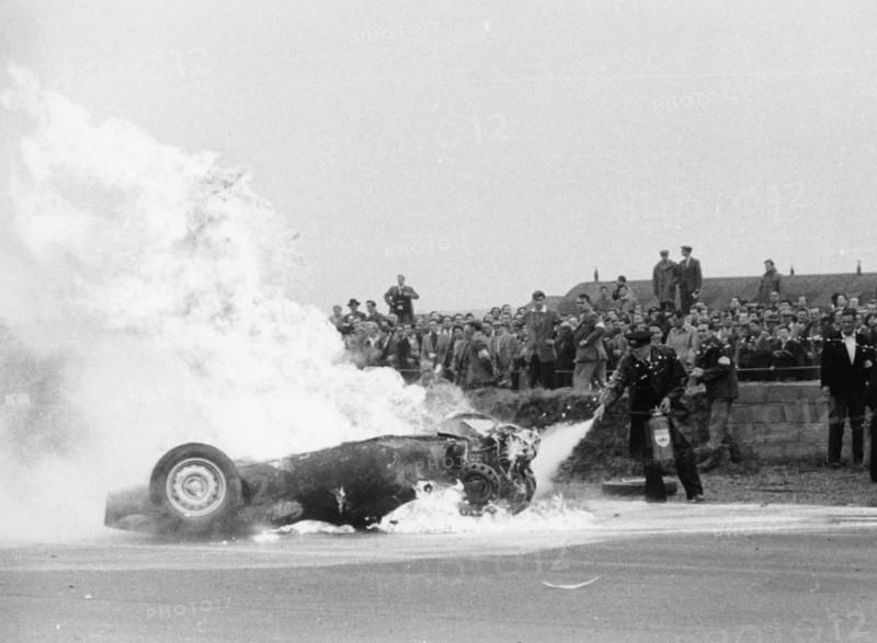 Tony Brooks' car on fire at the British Grand Prix, Silverstone, Northamptonshire,1956. Artist: Unknown