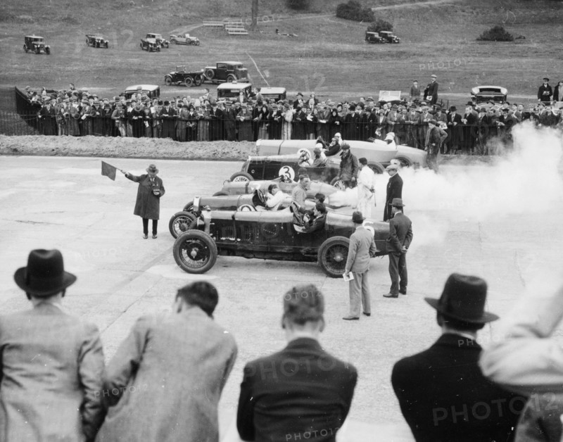 Cars lined up for the start of a race, Brooklands, Surrey, c 1925-c1930. Artist: Unknown