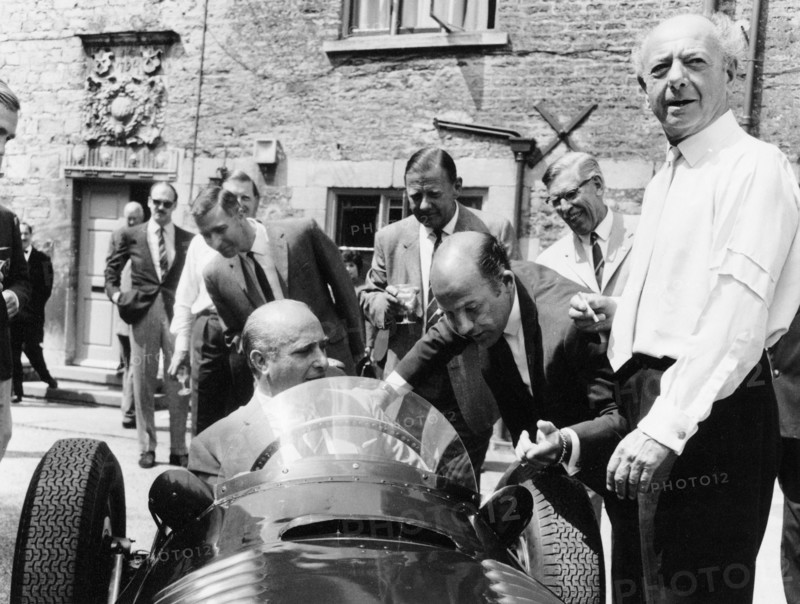 Juan Manuel Fangio at the wheel of a V16 BRM, (1960s?). Artist: Unknown