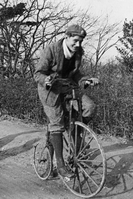 A young Lord Nuffield riding a bicycle down a country lane. Artist: Unknown