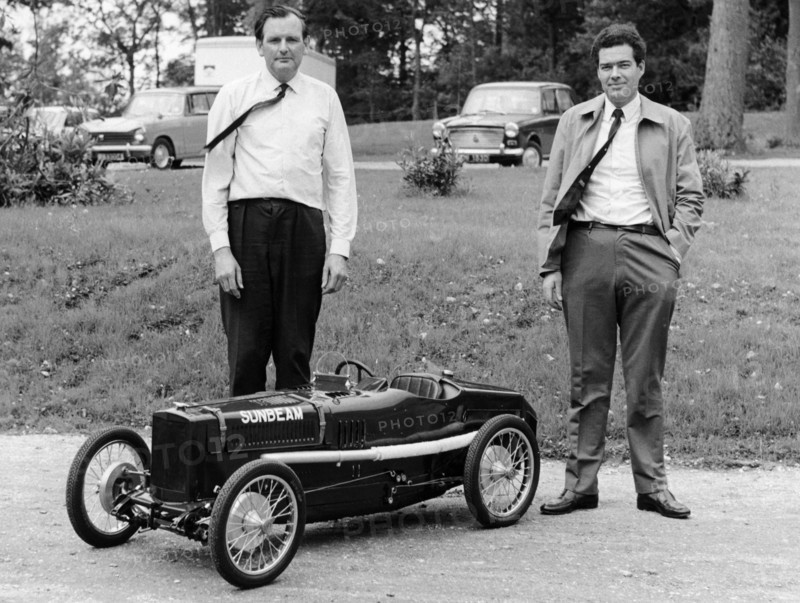 Two men standing by a miniature Sunbeam pedal car, 1960s. Artist: Unknown