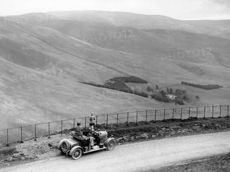 People with a Morris Cowley at the Devil's Beef Tub, Scotland, (c1930s?). Artist: Unknown
