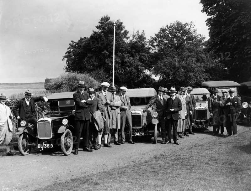 Group of people and cars on a country road, (c1930s?). Artist: Unknown