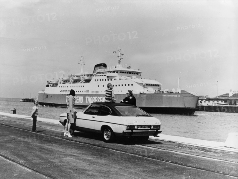 A 1974 Ford Capri on a quay, in front of a Townsend Thoresen car ferry, 1970s. Artist: Unknown