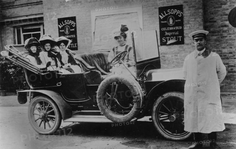 A group of ladies in a car, with their uniformed chauffeur, 1910. Artist: Unknown