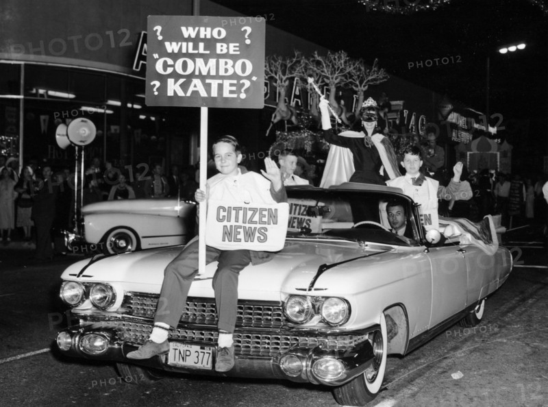 Fancy dress parade with a 1957 Cadillac, USA, (c1957?). Artist: Unknown
