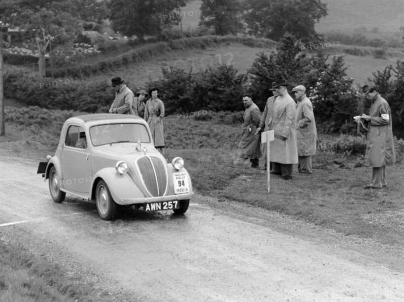 1937 Fiat 500 Coupe competing in the Welsh Rally. Artist: Unknown