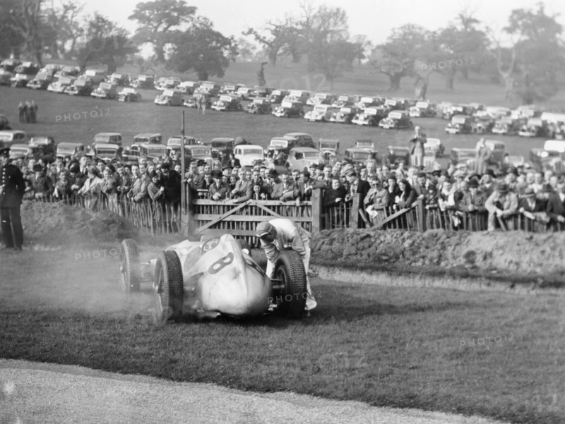 Dick Seaman with his Mercedes, Donington Grand Prix, 1938. Artist: Unknown