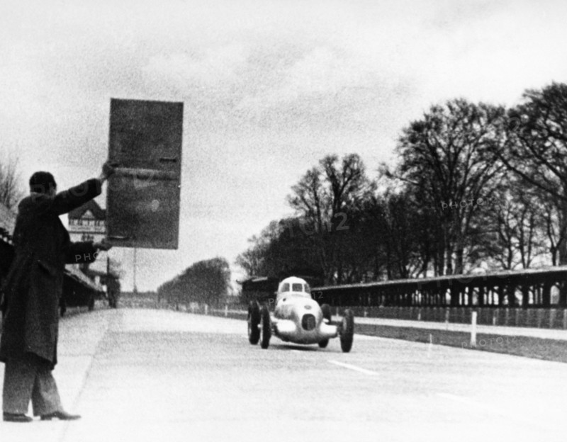 Rudolf Caracciola driving Mercedes-Benz W25 Streamliner car, 1934. Artist: Unknown