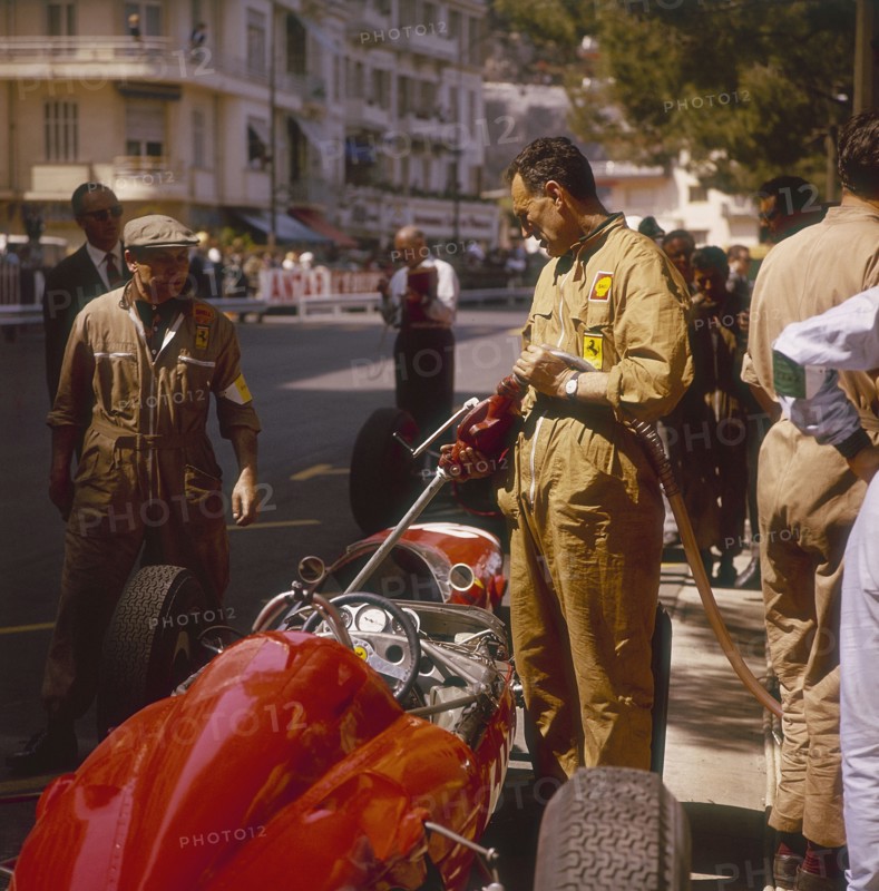 A Ferrari team member filling a car with fuel, Monaco Grand Prix, Monte Carlo, 1963. Artist: Unknown