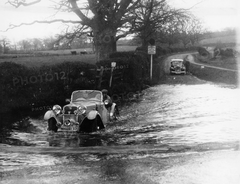 1935 Singer 1.5 Litre Le Mans taking part in a water splash trial, (1935?). Artist: Unknown
