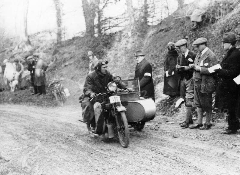 A competitor riding a Norton, competing in the Colmore Cup Trial, 1921. Artist: Unknown