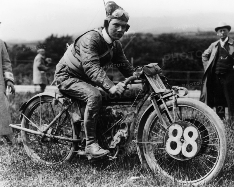 A man dressed in leathers on a Harley-Davidson. Artist: Unknown