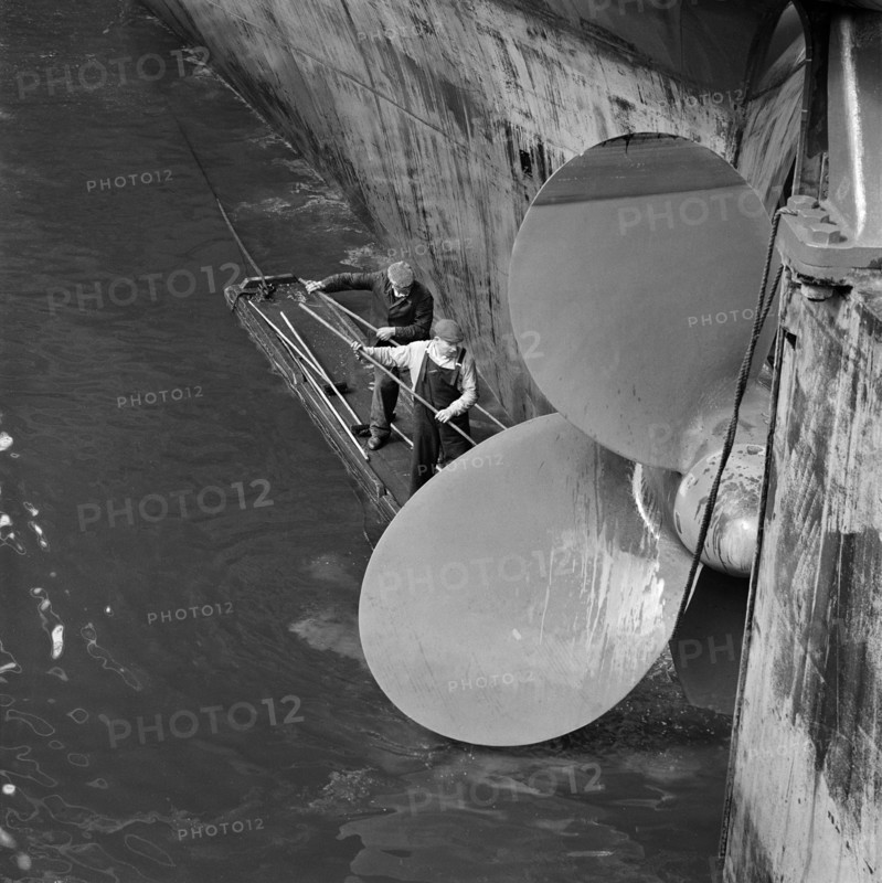 Cleaning the propellor of a ship, London Docks, September 1965