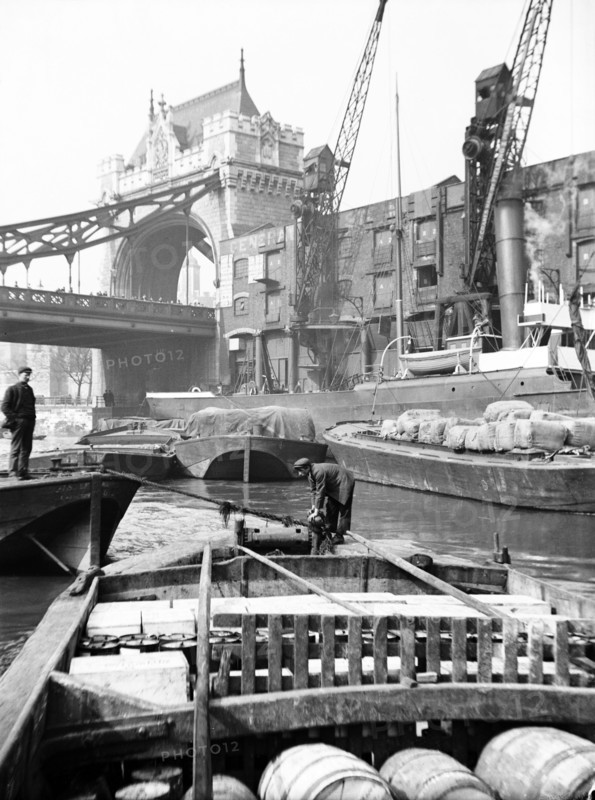 Lighters approaching the General Steam Navigation Company's wharf by Tower Bridge, London, c1905. Artist: Unknown