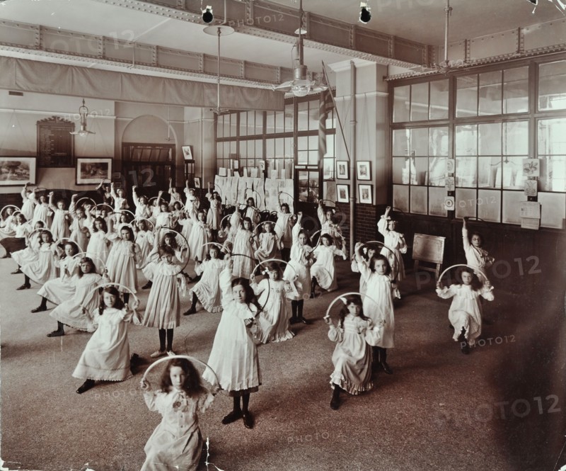 Girls with hoops, Lavender Hill Girls School, Bermondsey, London, 1906. Artist: Unknown.