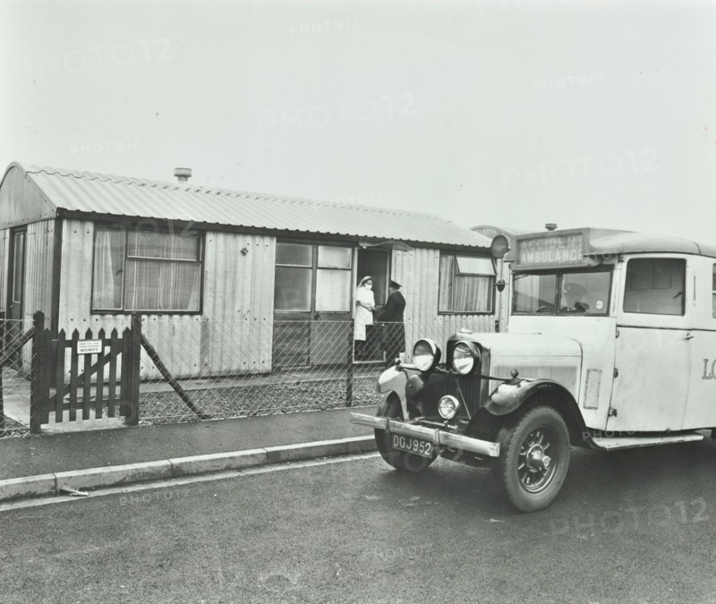 Ambulance delivering a cylinder of gas, Woolwich, London, 1946. Artist: Unknown.