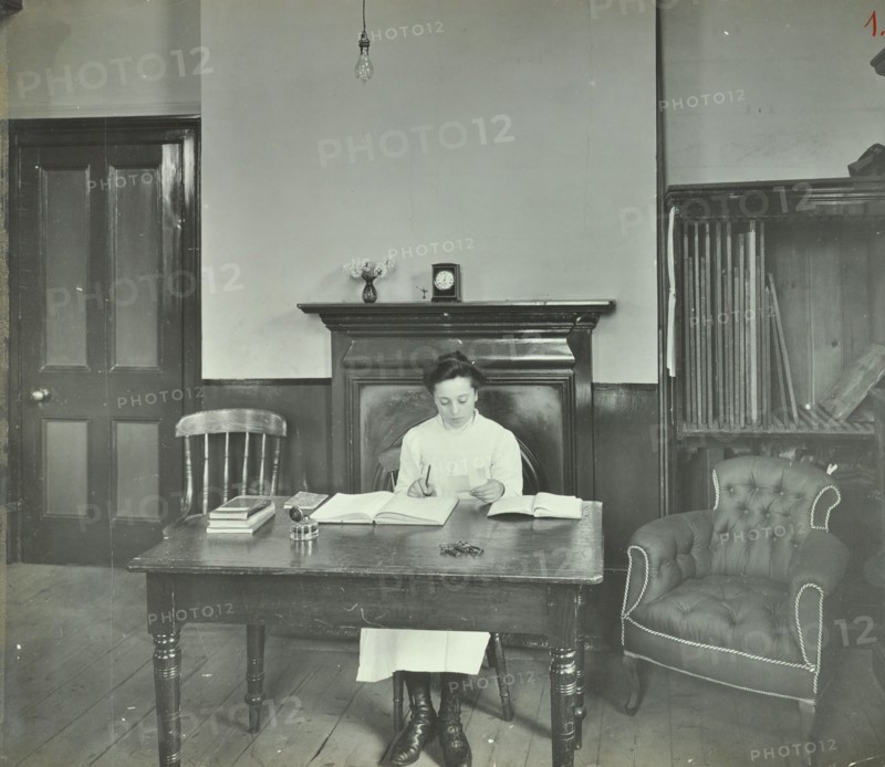 Female student sitting at desk, Shoreditch Technical Institute, London, 1907. Artist: Unknown.