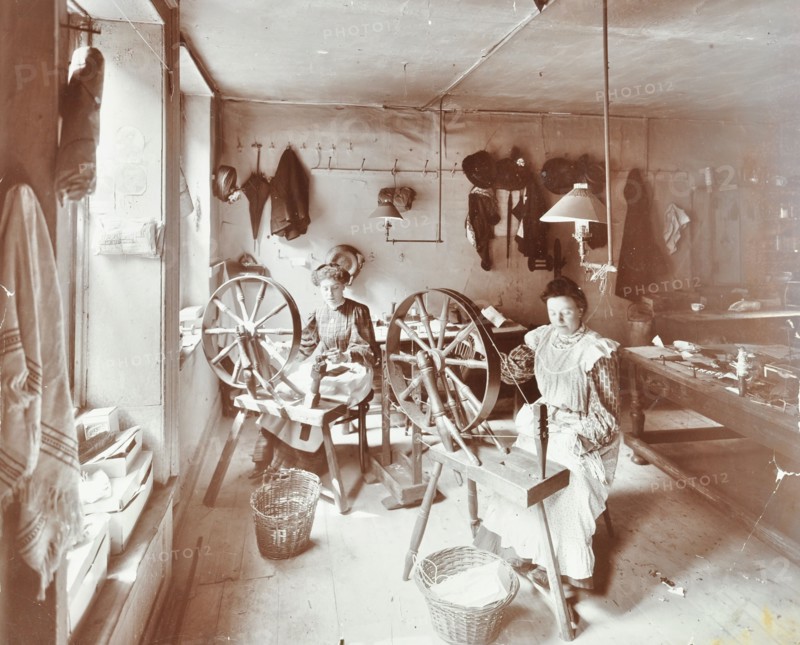 Women using spinning wheels, Bethnal Green, London, 1908. Artist: Unknown.