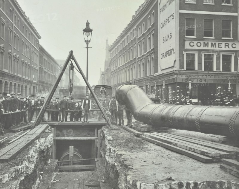Replacing an old gas main, Commercial Street, London, 1906. Artist: Unknown.