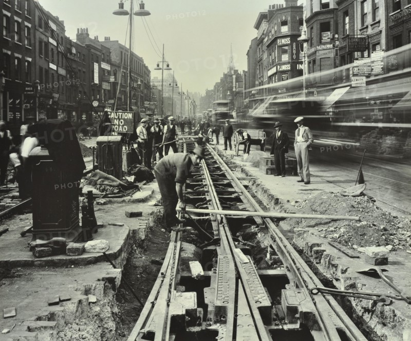 Men laying tramlines in the middle of the road, Whitechapel High Street, London, 1929. Artist: Unknown.