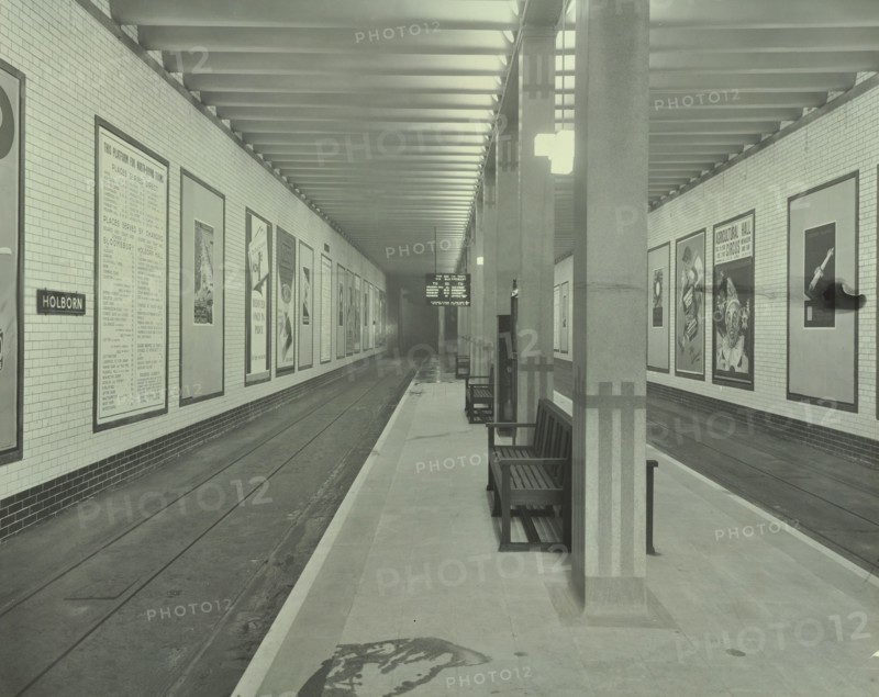 Platform with advertising posters, Holborn Underground Tram Station, London, 1931. Artist: Unknown.