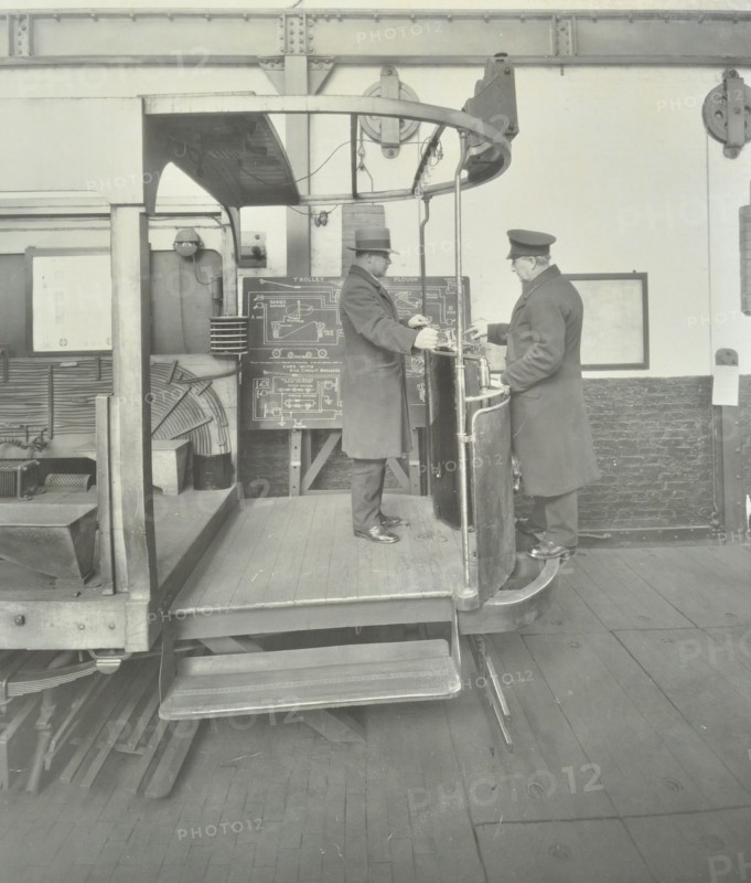 Learner-driver under instruction in a mock-up of tram car cab, London, 1932. Artist: Unknown.