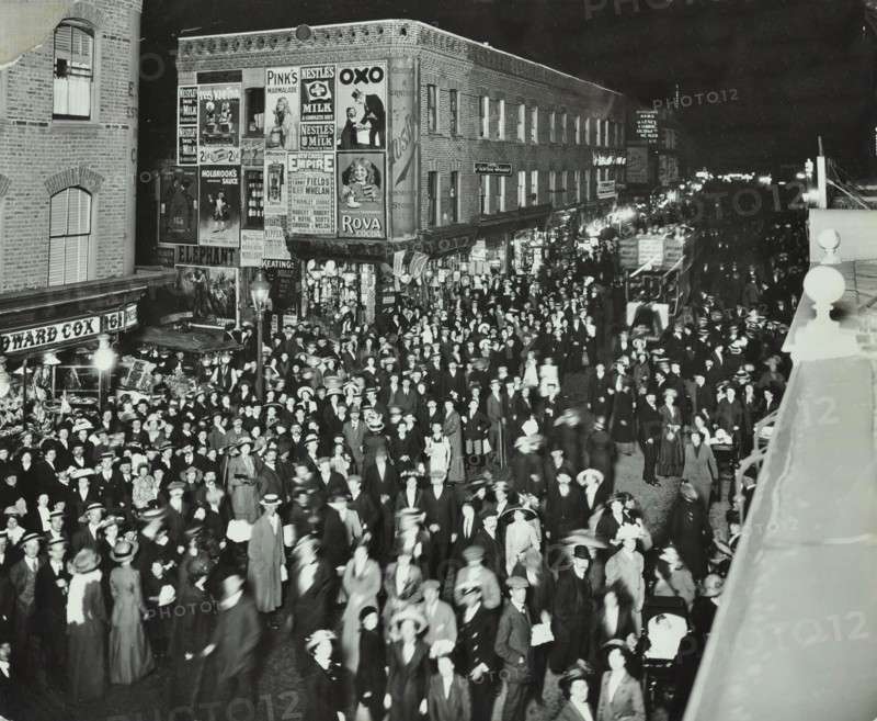 Crowds of shoppers in Rye Lane at night, Peckham, London, 1913. Artist: Unknown.
