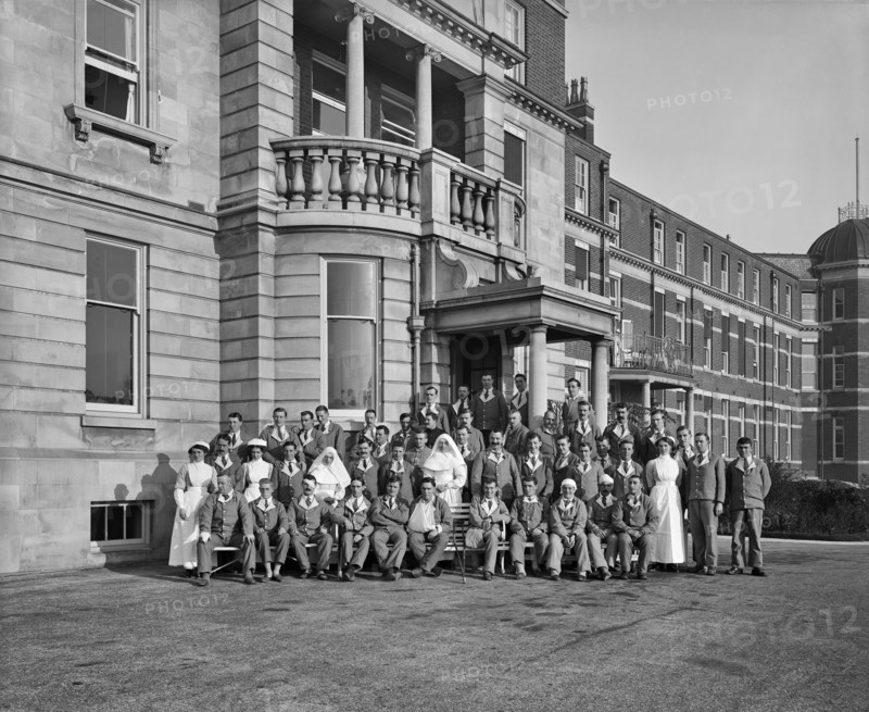 Nurses, nuns and military patients outside St Andrew's Hospital, Dollis Hill, London, October 1916
