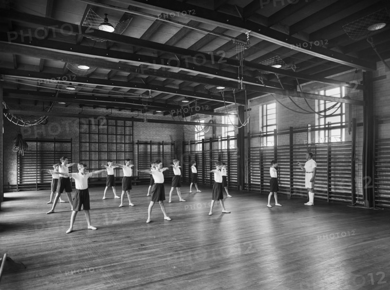 Physical Education in the gymnasium, Merchant Taylors School, Northwood, Hertfordshire, 1933-1939 Artist