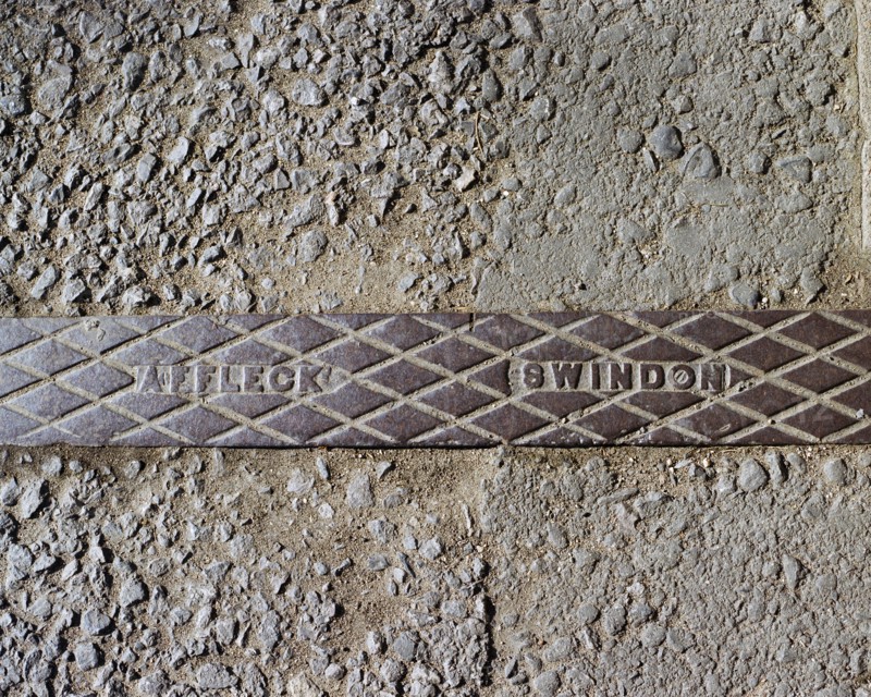 Pavement rainwater gully cover plate made by Affleck of Swindon, Swindon, Wiltshire, 2006