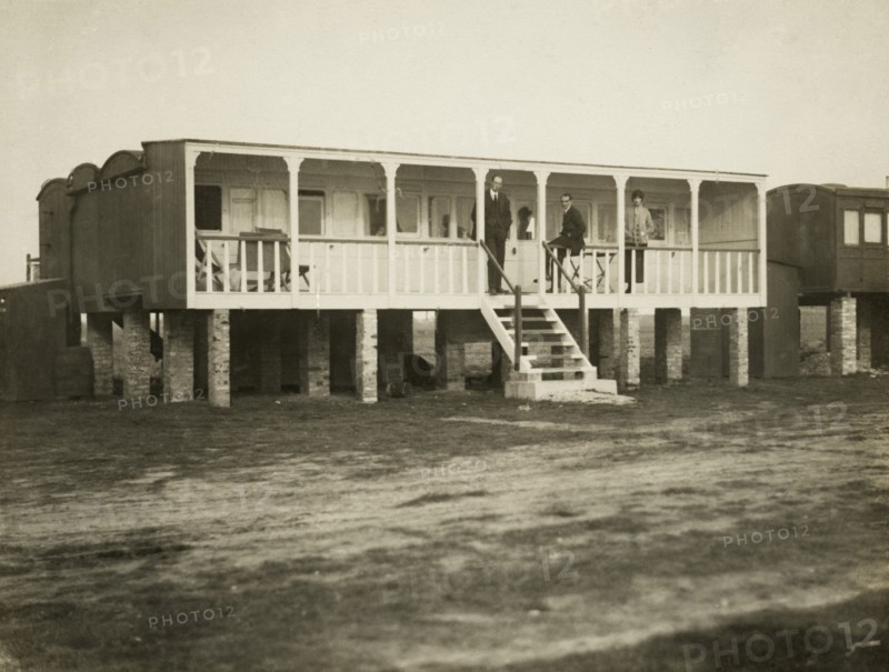 Railway carriage converted into a holiday home, possibly at Shoreham-by-Sea, West Sussex, 1920s