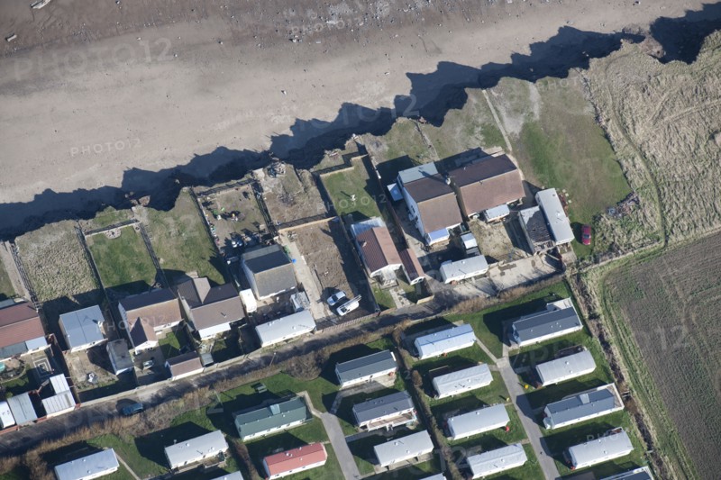 Bungalows at risk from coastal erosion, Green Lane, near Skipsea, East Riding of Yorkshire, 2014