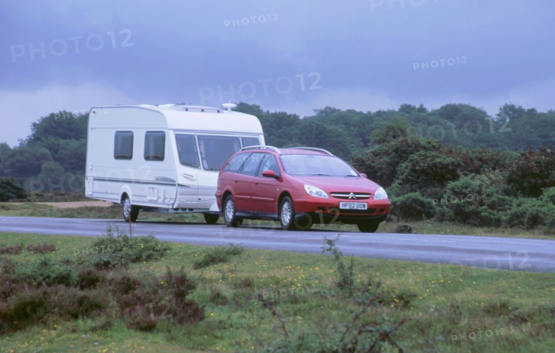 2002 Citroen C5 hdi towing a caravan. Artist: Unknown.