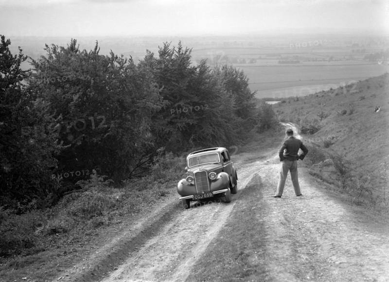 1935 Hillman Minx 1185 cc competing in a Talbot CC trial. Artist: Bill Brunell.