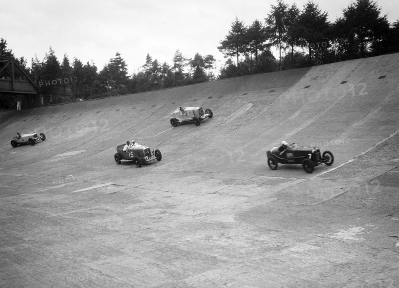 Talbot, Lagonda and Invicta racing on the Members Banking at Brooklands. Artist: Bill Brunell.
