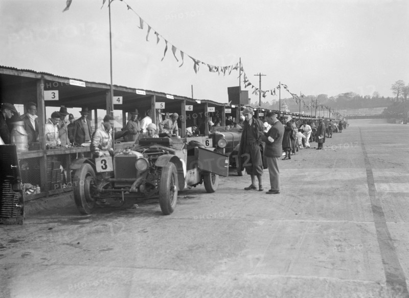Invicta of FH Cairnes and George Field in the pits at the JCC Double Twelve race, Brooklands, 1931. Artist: Bill Brunell.